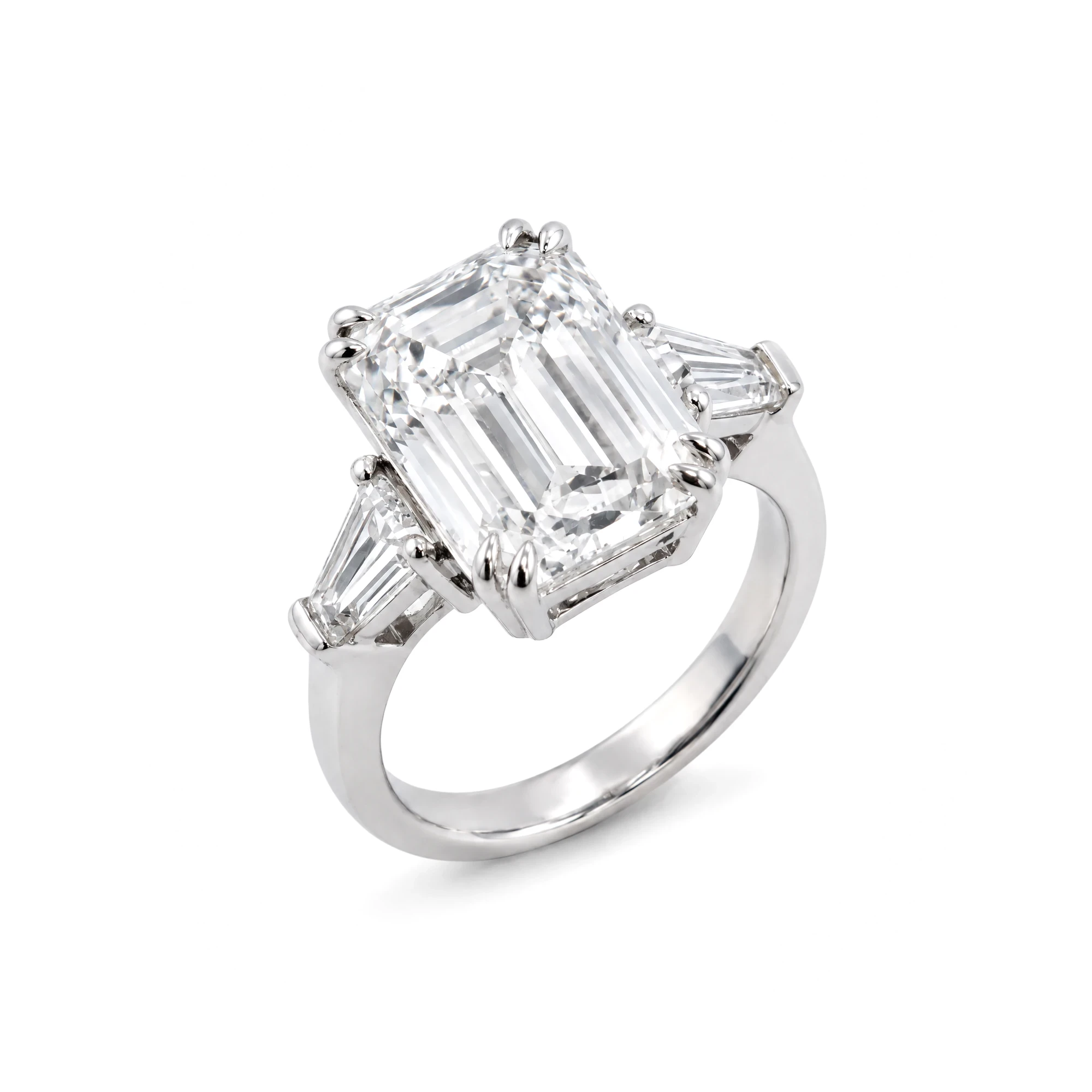 The finished packshot: the same emerald-cut ring upright in a three-quarter view on pure white
